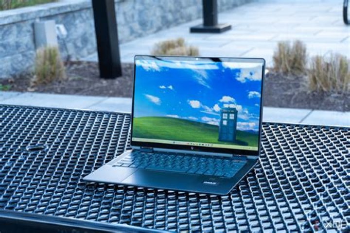 How do I turn on my HP Spectre x360 laptop?
