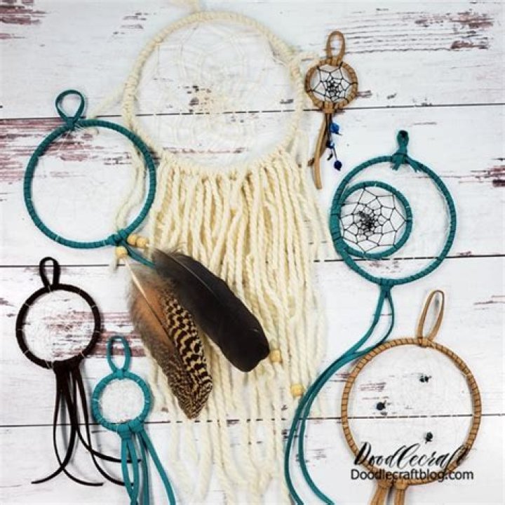 How do you put feathers on a dreamcatcher?