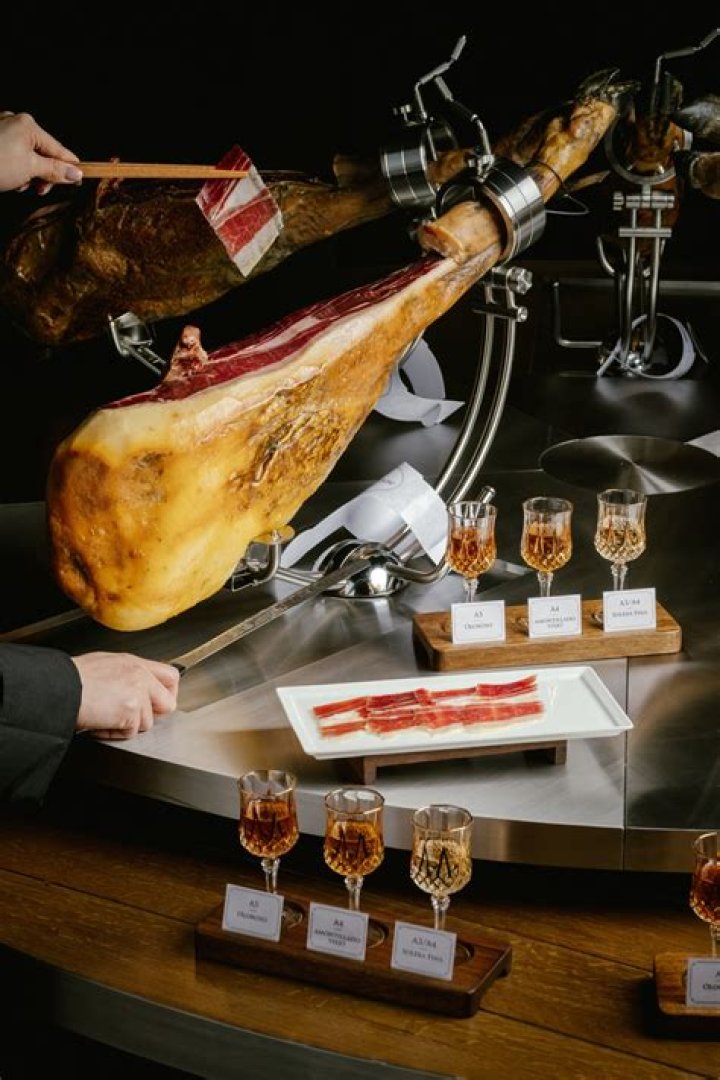 How is ham cured in Spain?
